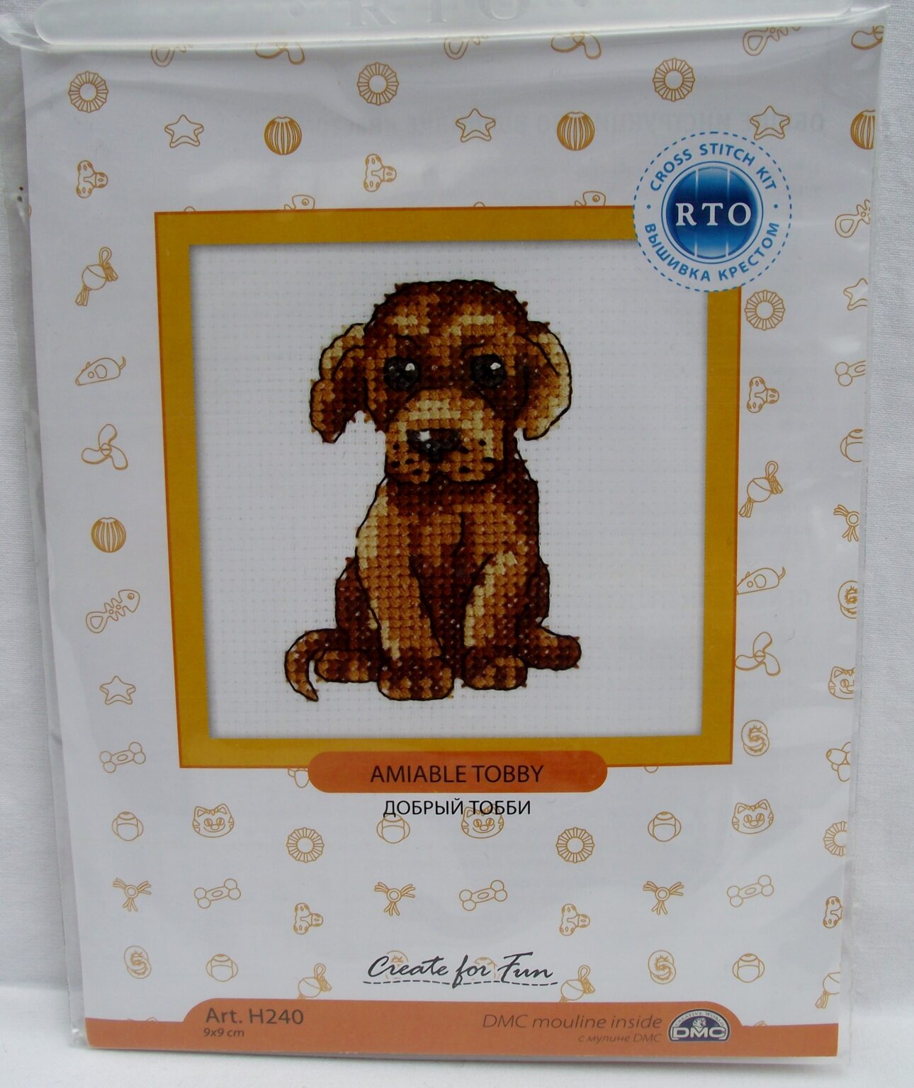 Amiable Tobby H240 Counted Cross Stitch Kit featuring white Aida fabric, colorful threads, and included needle and instructions.